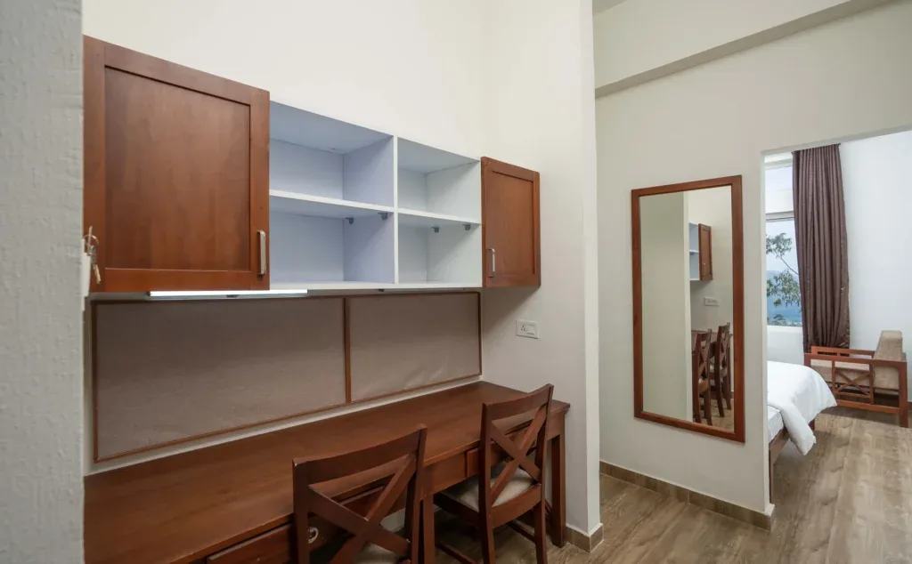 Dedicated study area with two tables, chairs, storage cupboards